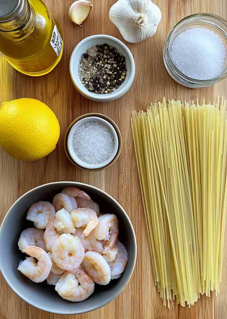 Ingredients for shrimp and pasta recipes including shrimp, spaghetti, garlic, and lemon
