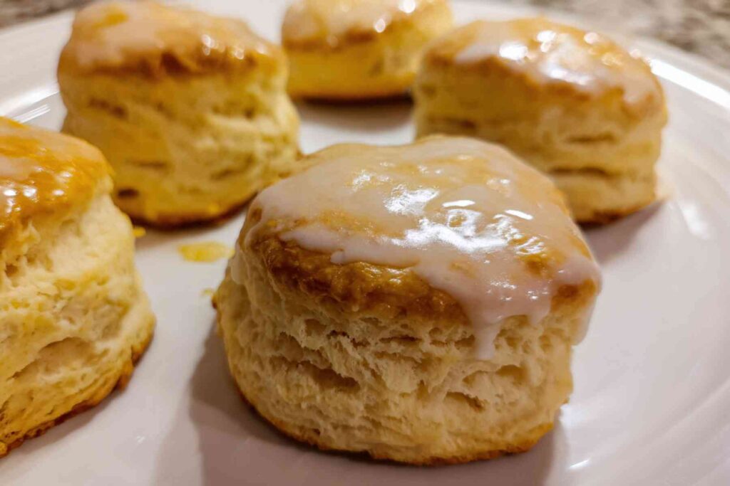 Lemon scone broken open showing soft crumb and zest