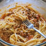 Ground beef recipes with browned beef cooking in skillet