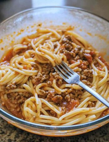 Ground beef recipes with browned beef cooking in skillet