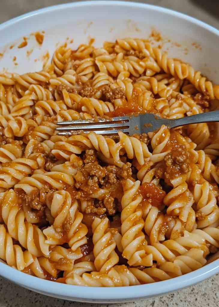 Ground beef recipes served with rice and vegetables in bowl