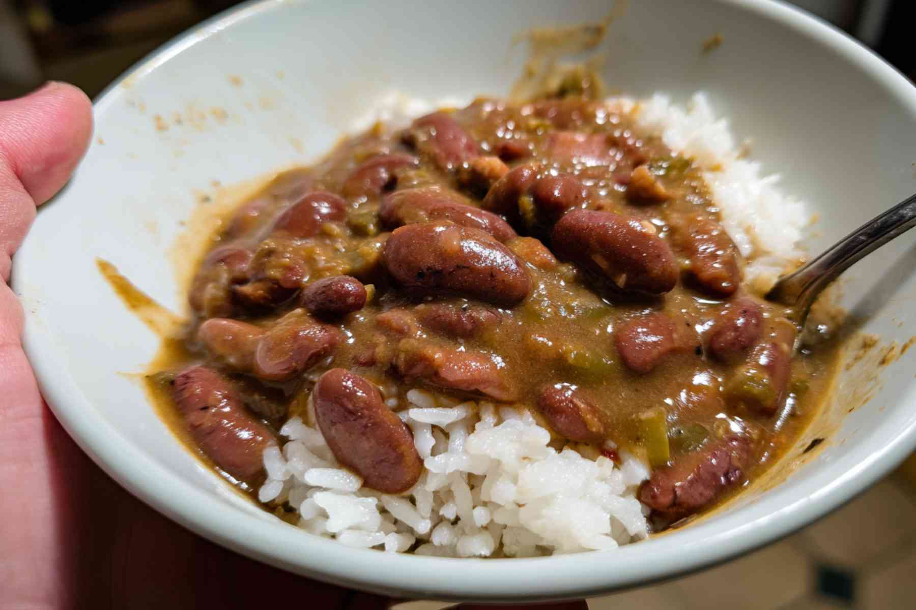 Leftover red beans and rice in glass storage container on counter