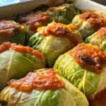 Sautéed cabbage cooking in skillet on stove