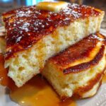 Sheet pan pancakes baked in rectangular pan with golden top