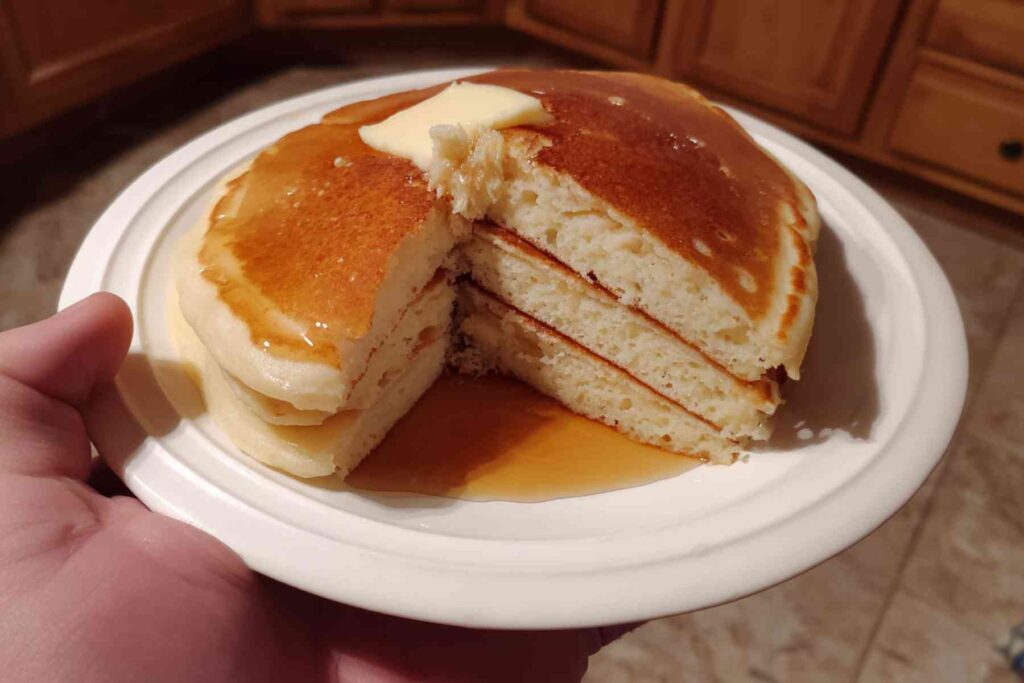 Pancake batter spread in sheet pan before baking sheet pan pancakes