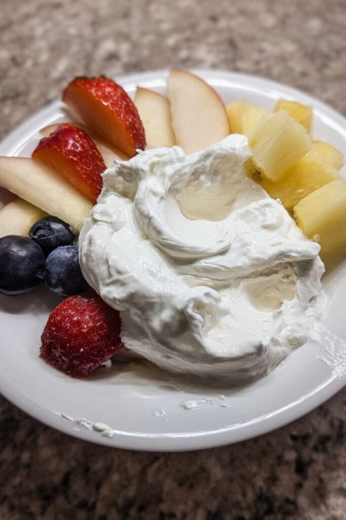 Close-up of fruit dip with cream cheese showing smooth texture